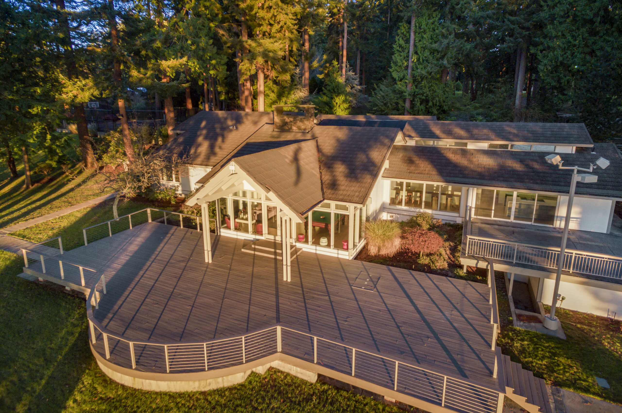 Aerial view of modern house with large deck.